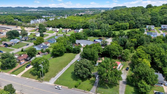 an aerial view of house with yard