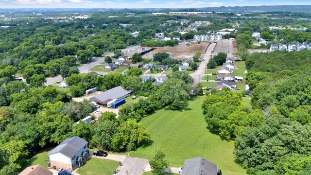 an aerial view of residential house with outdoor space