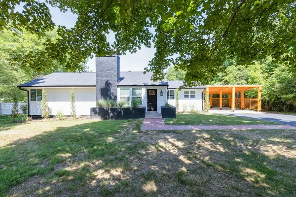 front view of a house with a yard