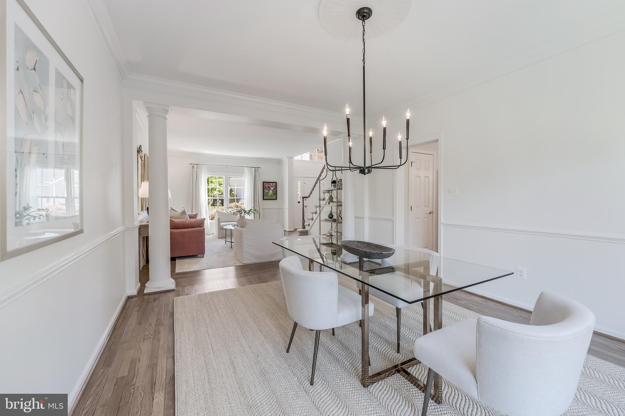 12537 Ridgegate Drive Herndon, VA 20170 - Photo 22 of 80 a view of a dining room and livingroom with furniture wooden floor a chandelier