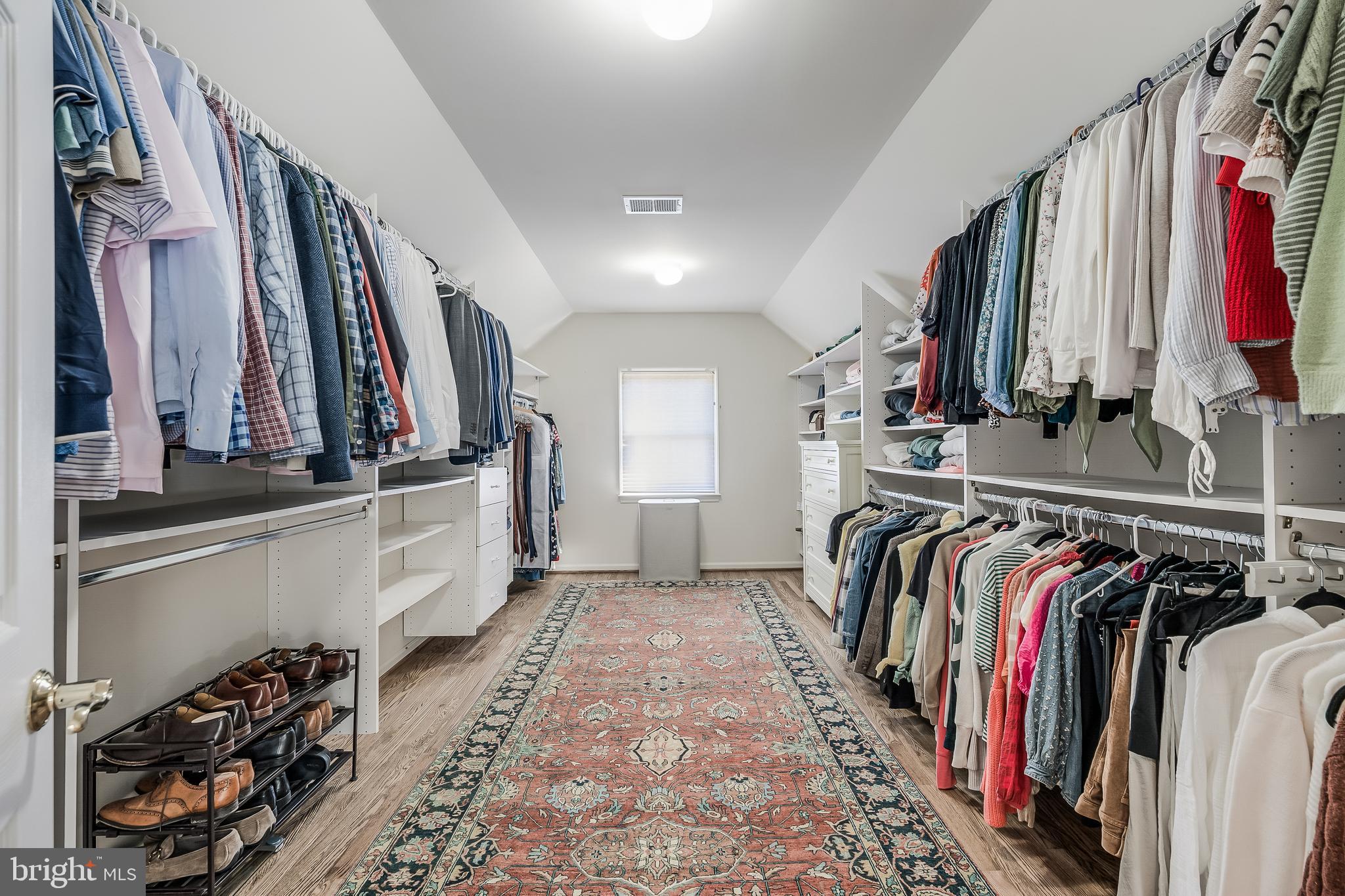 12537 Ridgegate Drive Herndon, VA 20170 - Photo 46 of 80 a view of walk in closet with clothes and shoes