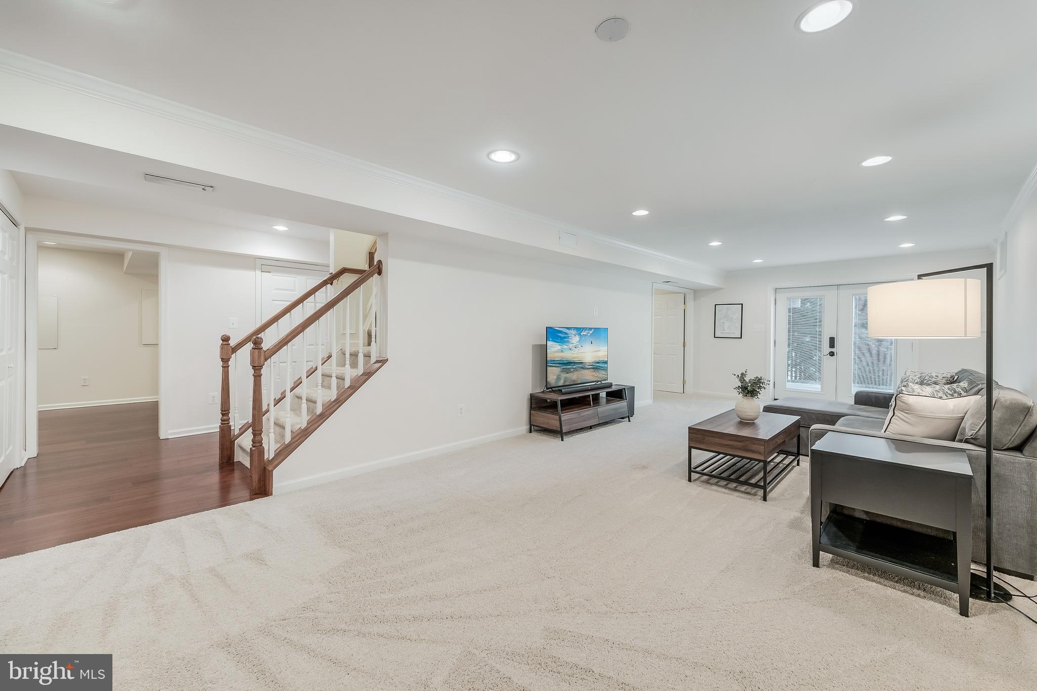 12537 Ridgegate Drive Herndon, VA 20170 - Photo 59 of 80 a living room with furniture and a flat screen tv