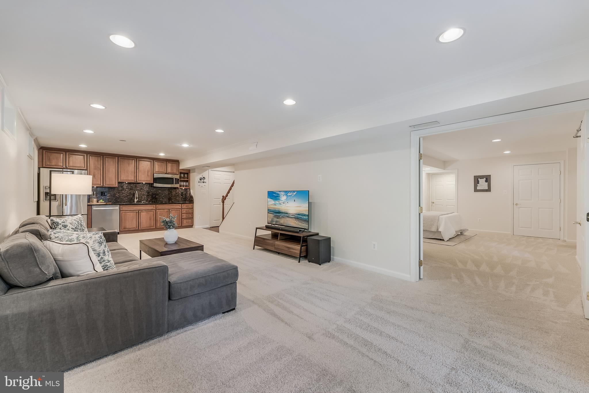 12537 Ridgegate Drive Herndon, VA 20170 - Photo 60 of 80 a living room with furniture and a flat screen tv