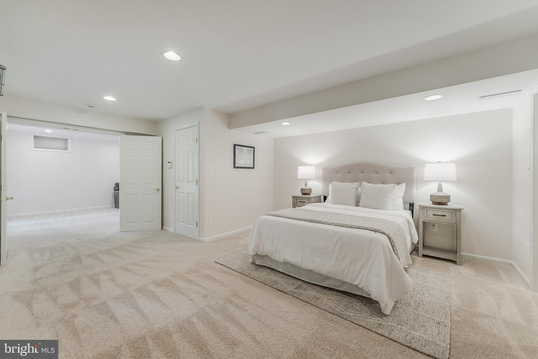 12537 Ridgegate Drive Herndon, VA 20170 - Photo 63 of 80 a bedroom with a bed and a night stand