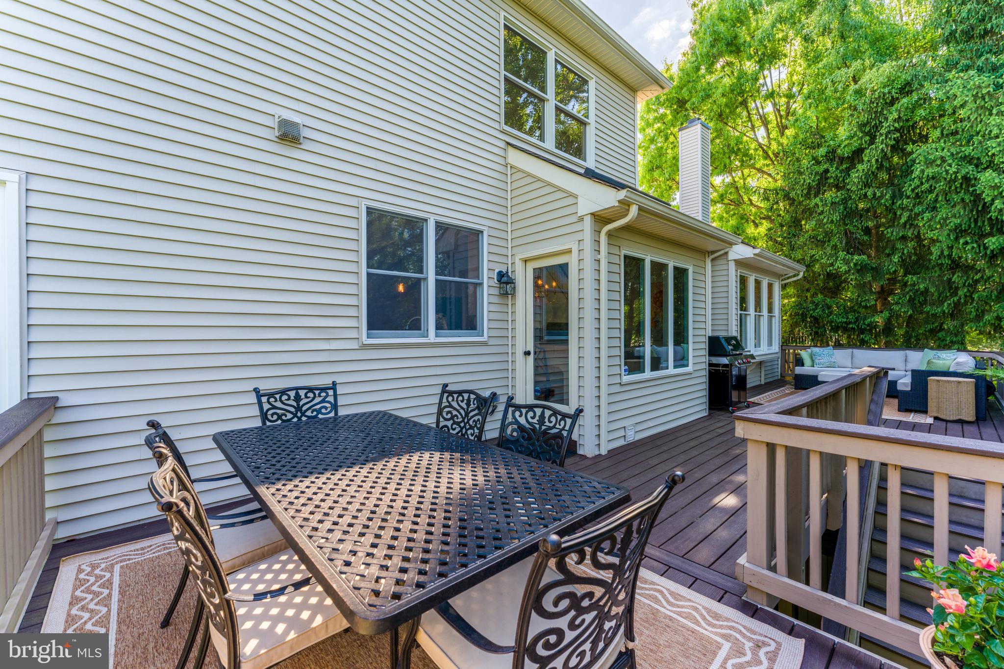 12537 Ridgegate Drive Herndon, VA 20170 - Photo 77 of 80 a view of a house with wooden deck and furniture