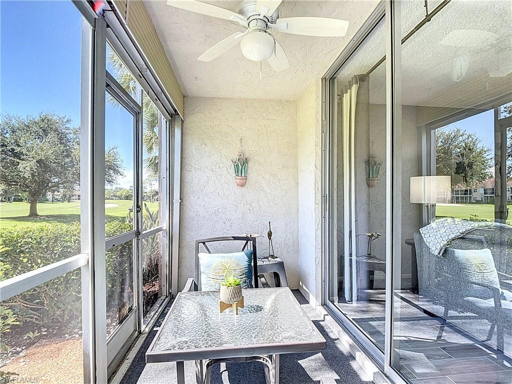 200 Turtle Lake Court, Unit 109 Naples, FL 34105 - Photo 33 of 37 Sunroom / solarium featuring a ceiling fan