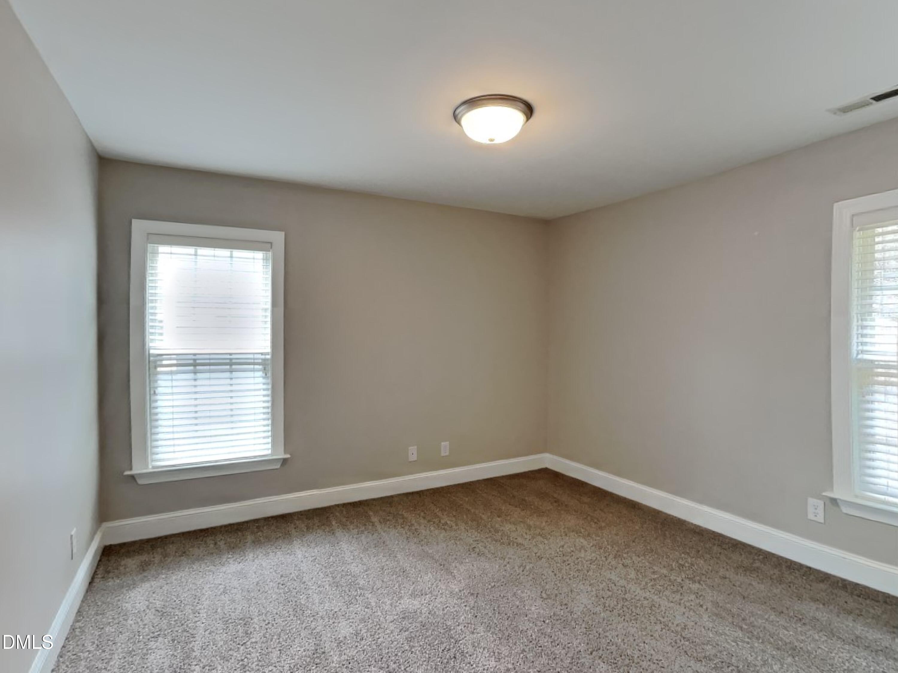 9531 Waterwood Court Raleigh, NC 27614 - Photo 13 of 19 an empty room with a window