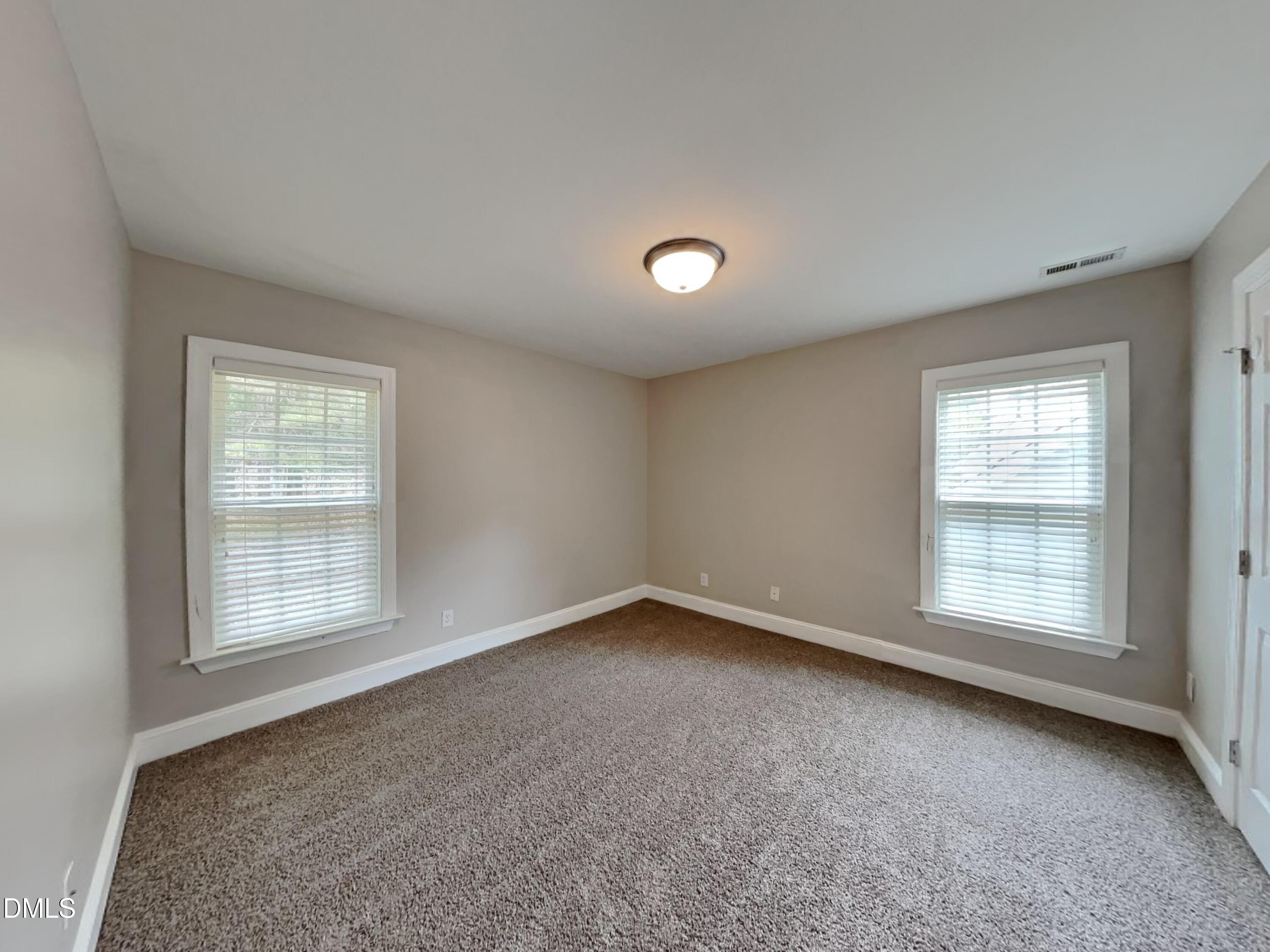 9531 Waterwood Court Raleigh, NC 27614 - Photo 14 of 19 an empty room with a window