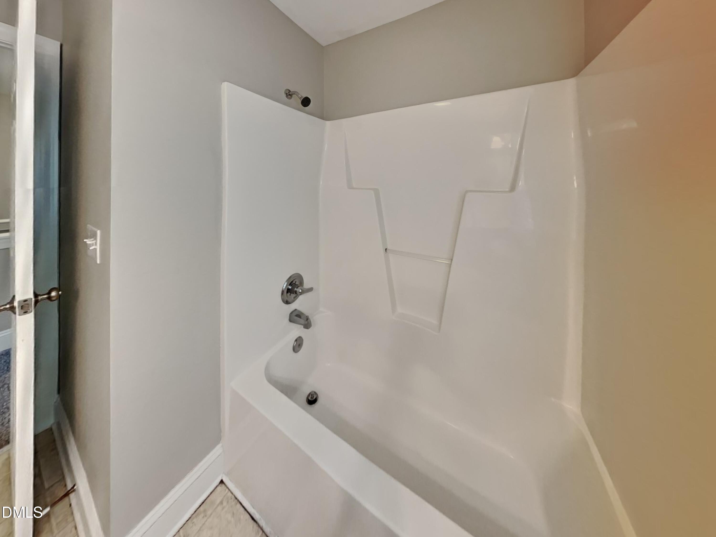 9531 Waterwood Court Raleigh, NC 27614 - Photo 16 of 19 a bathroom with a bathtub