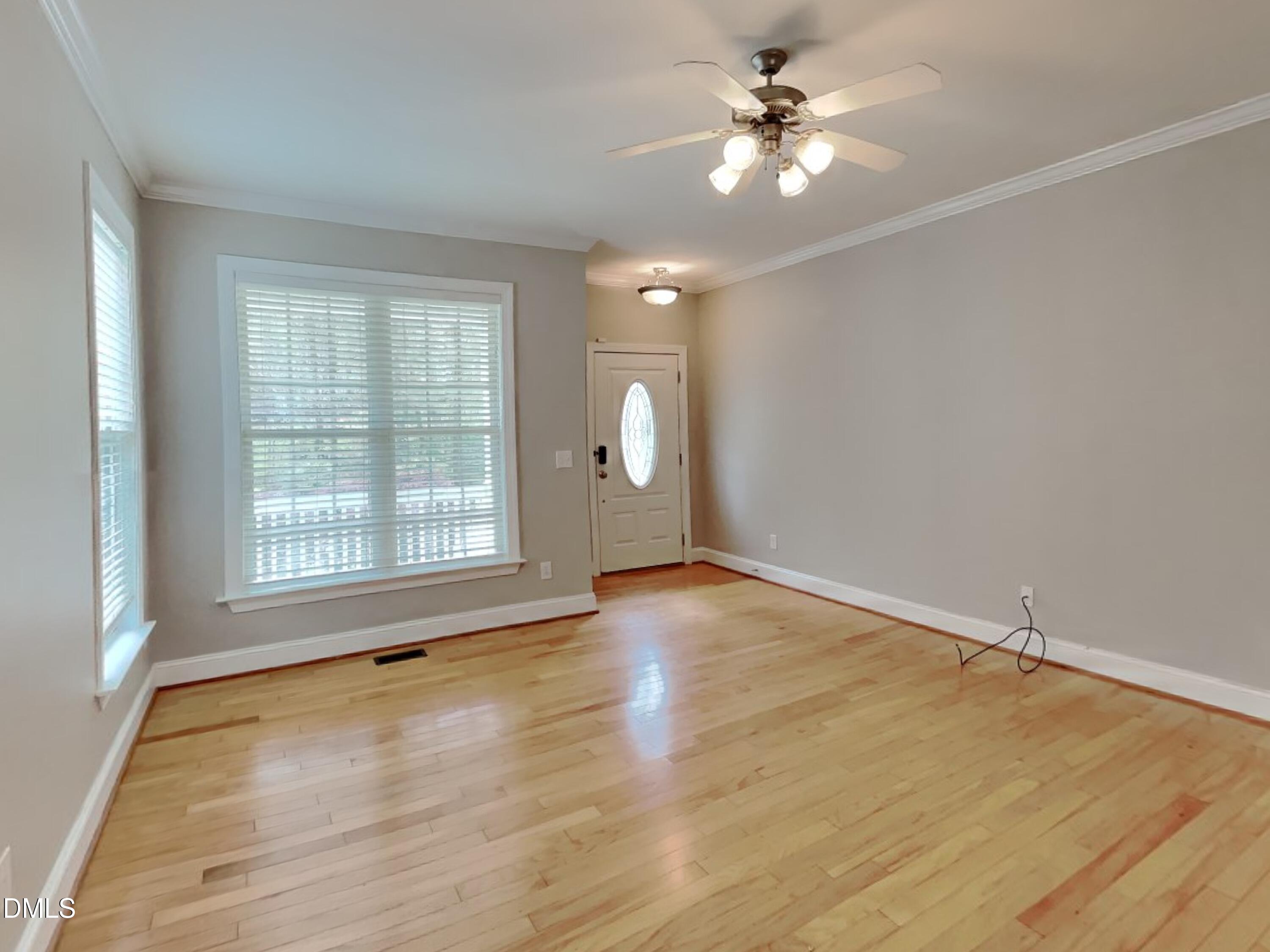 9531 Waterwood Court Raleigh, NC 27614 - Photo 3 of 19 wooden floor chandelier and windows in a room