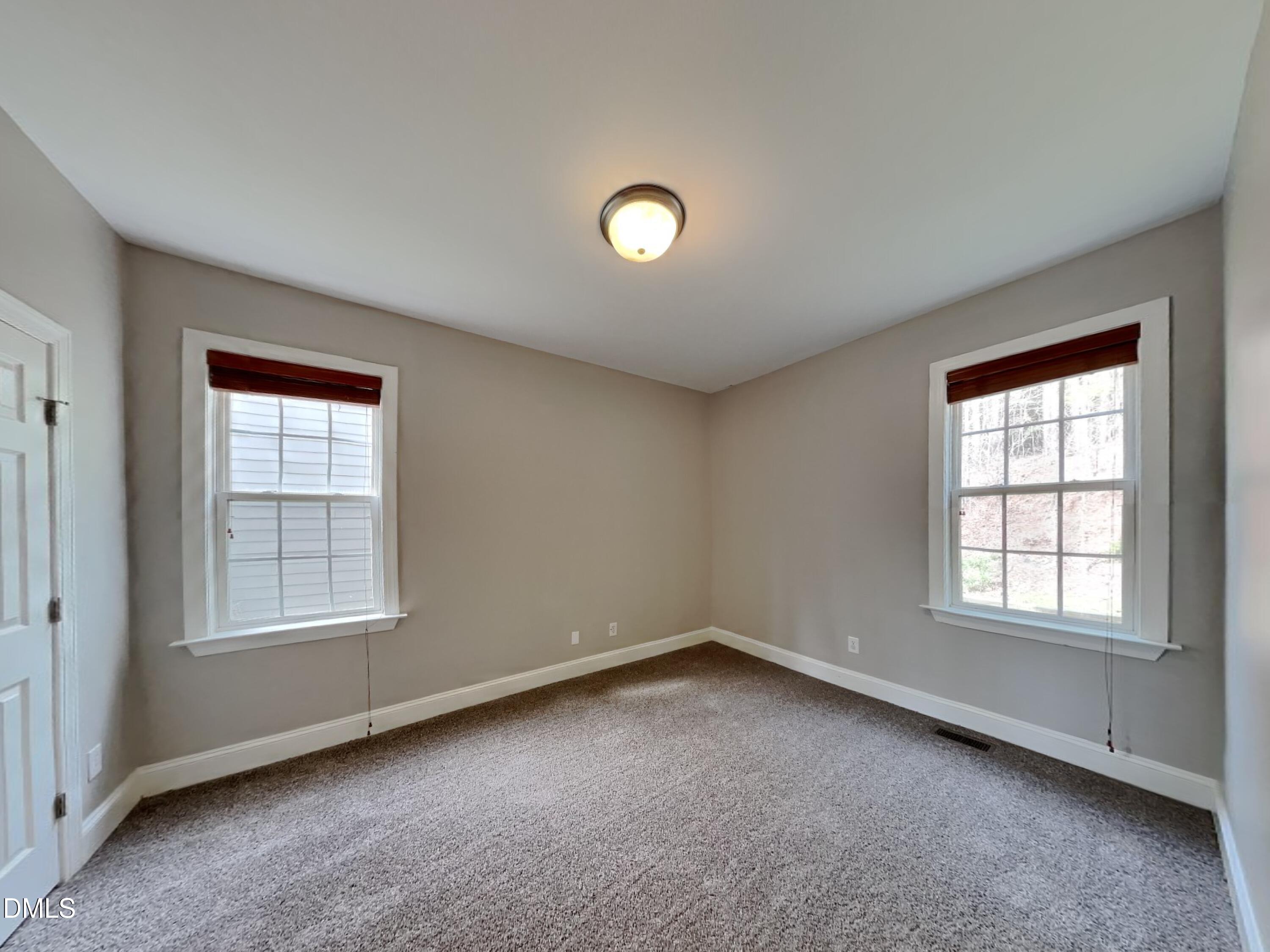 9531 Waterwood Court Raleigh, NC 27614 - Photo 7 of 19 an empty room with a window