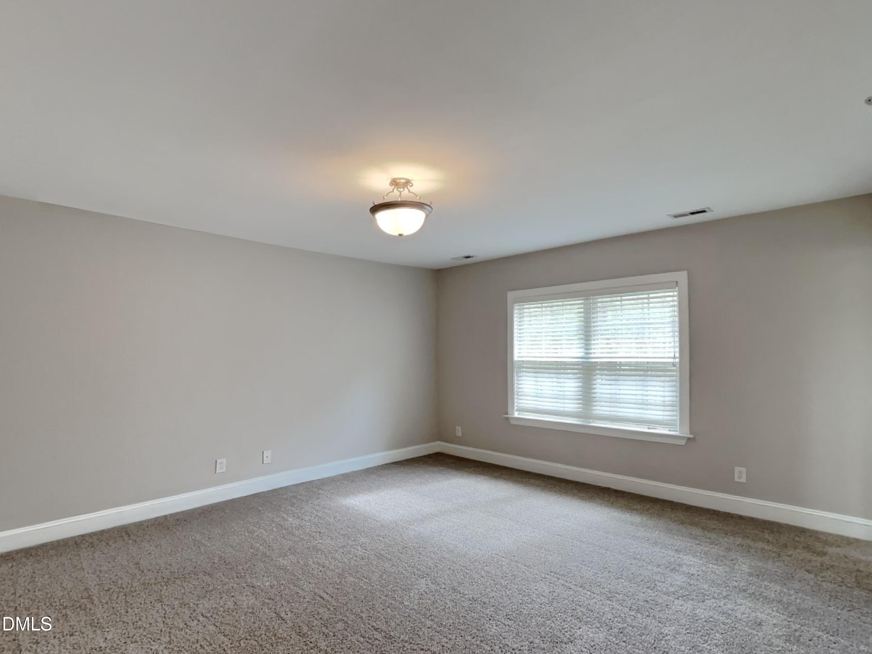 9531 Waterwood Court Raleigh, NC 27614 - Photo 8 of 19 an empty room with a empty space and windows