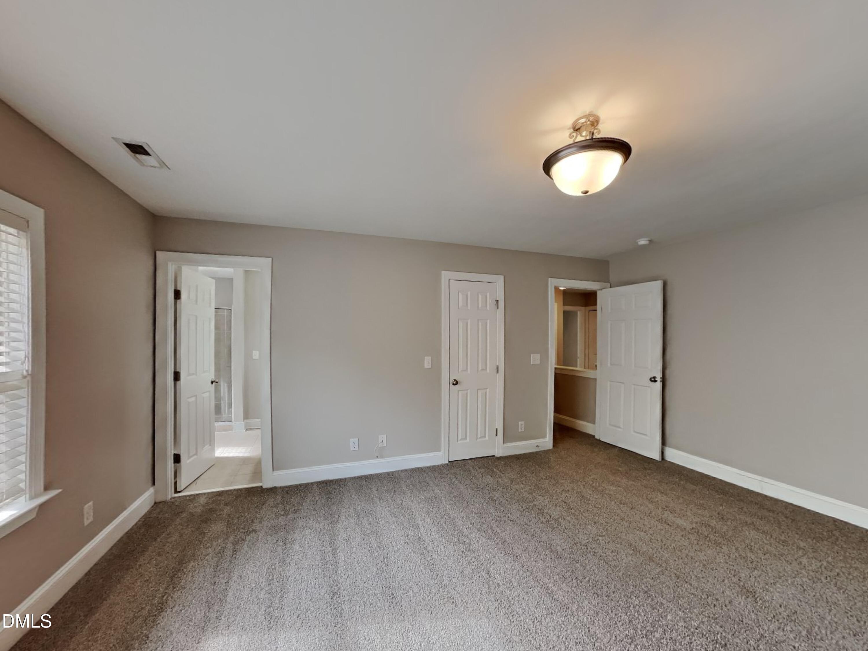 9531 Waterwood Court Raleigh, NC 27614 - Photo 9 of 19 a view of an empty room and window