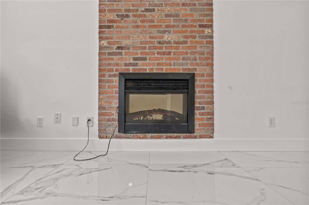3104 Apricot Street Seffner, FL 33584 - Photo 11 of 31 a living room with a fireplace