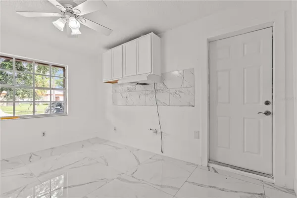 a view of an empty room with a window