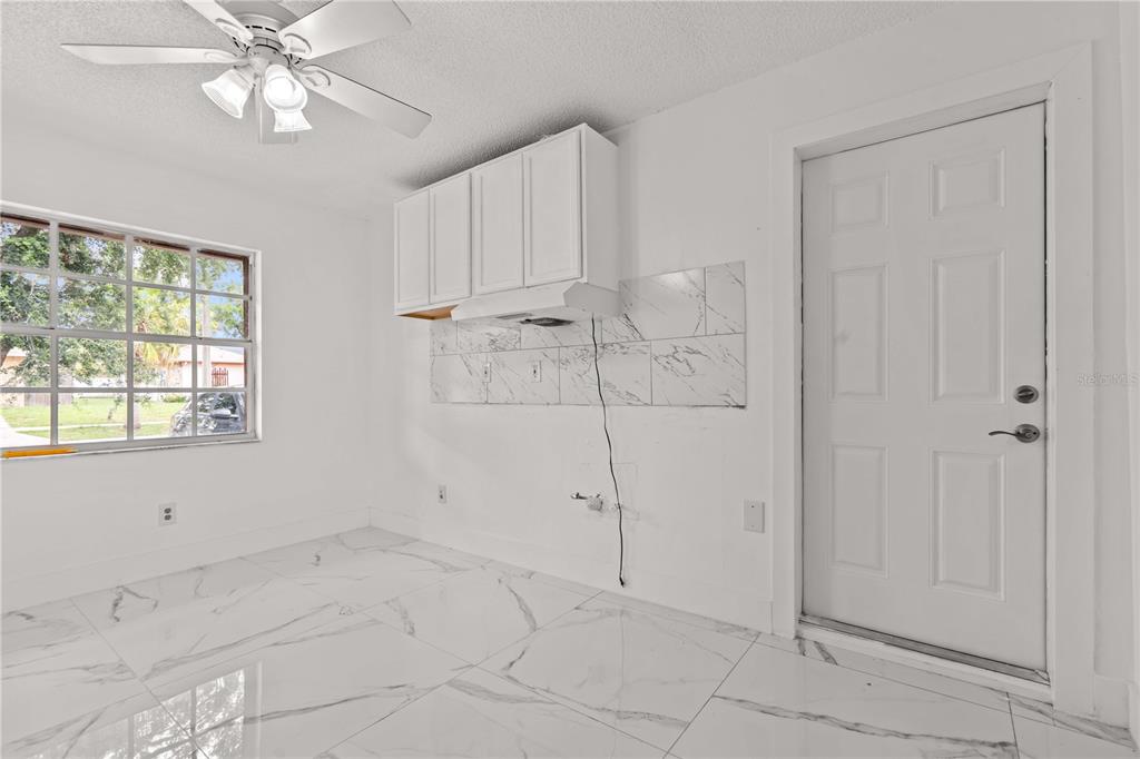 3104 Apricot Street Seffner, FL 33584 - Photo 14 of 31 a view of an empty room with a window