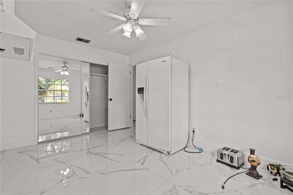 3104 Apricot Street Seffner, FL 33584 - Photo 16 of 31 a view of a livingroom with a chandelier fan and windows