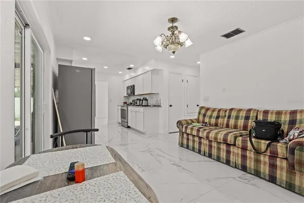 a bedroom with a bed and a ceiling fan