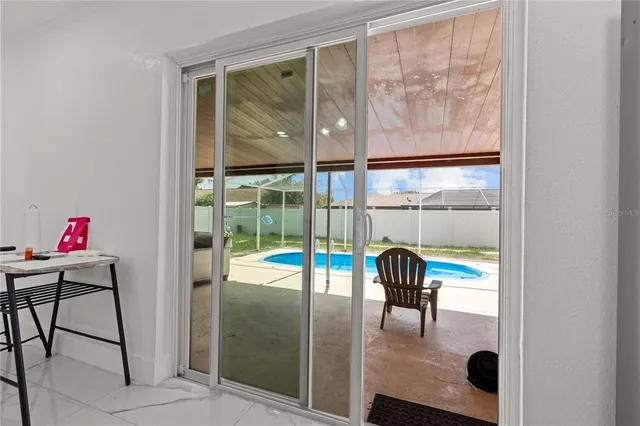 a backyard of a house with plants and trees