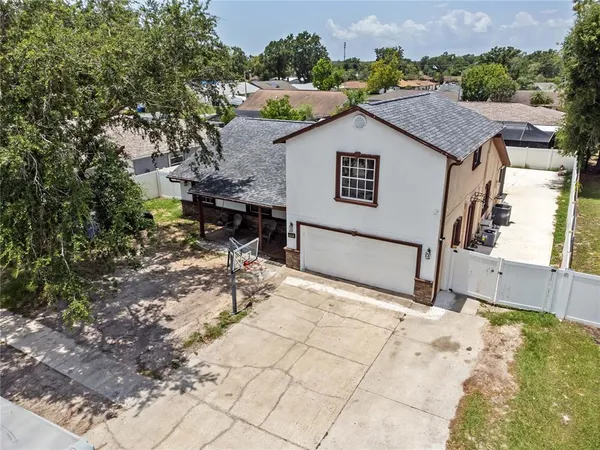 an aerial view of residential houses with outdoor space