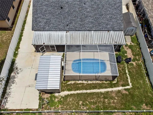 an aerial view of residential building with green space