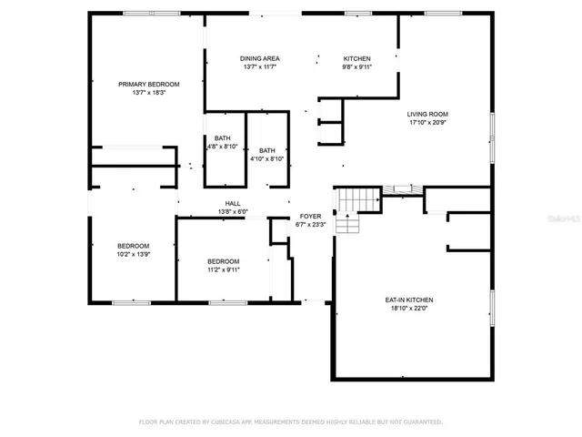 a picture of a bench in front of a gate