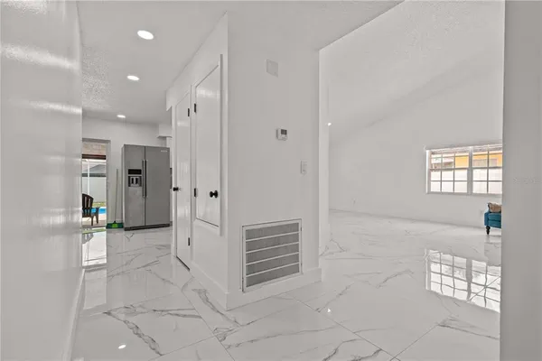 a living room with furniture and a gate