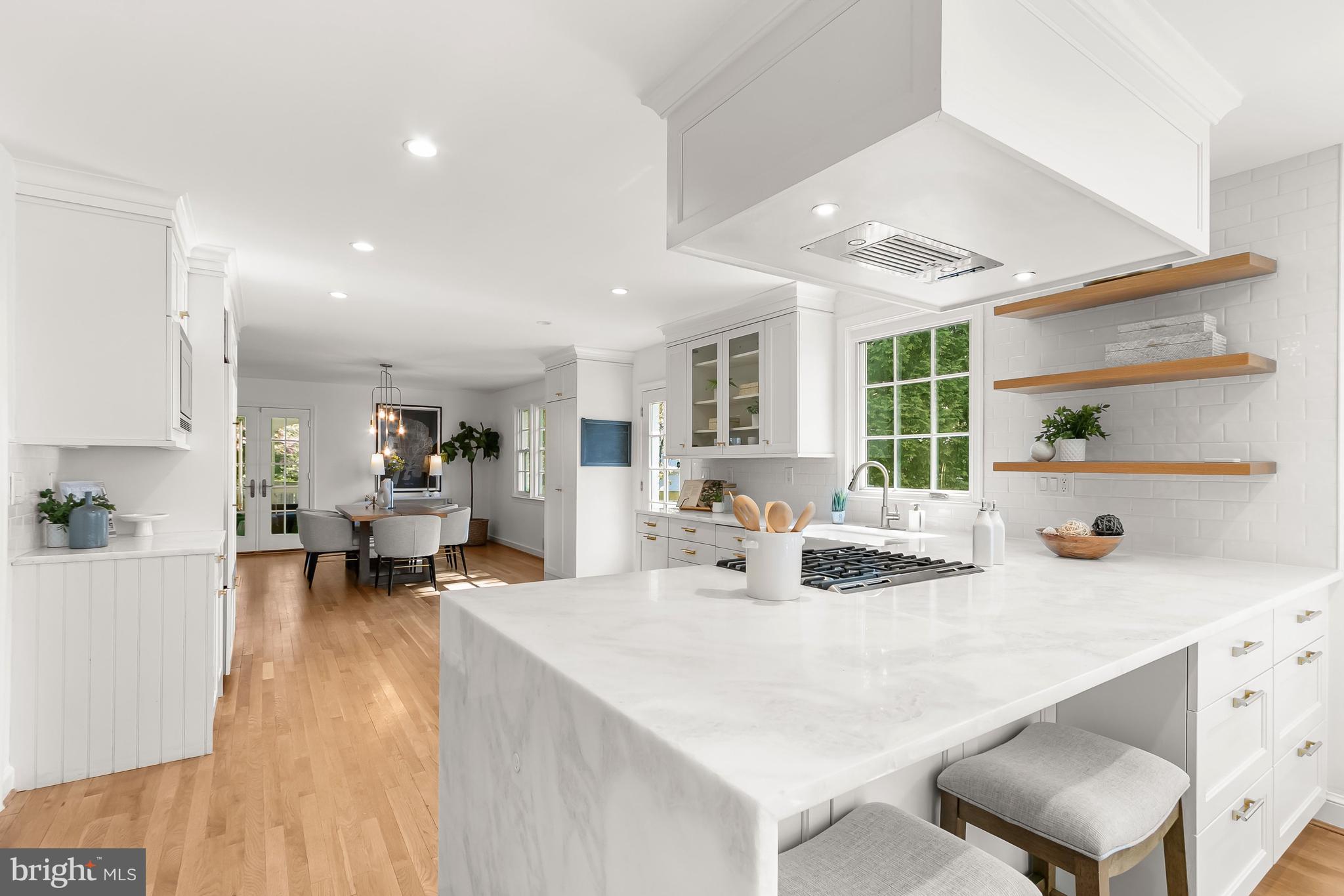 5120 Upton Street Northwest Washington, DC 20016 - Photo 12 of 53 a living room with kitchen island furniture and a wooden floor