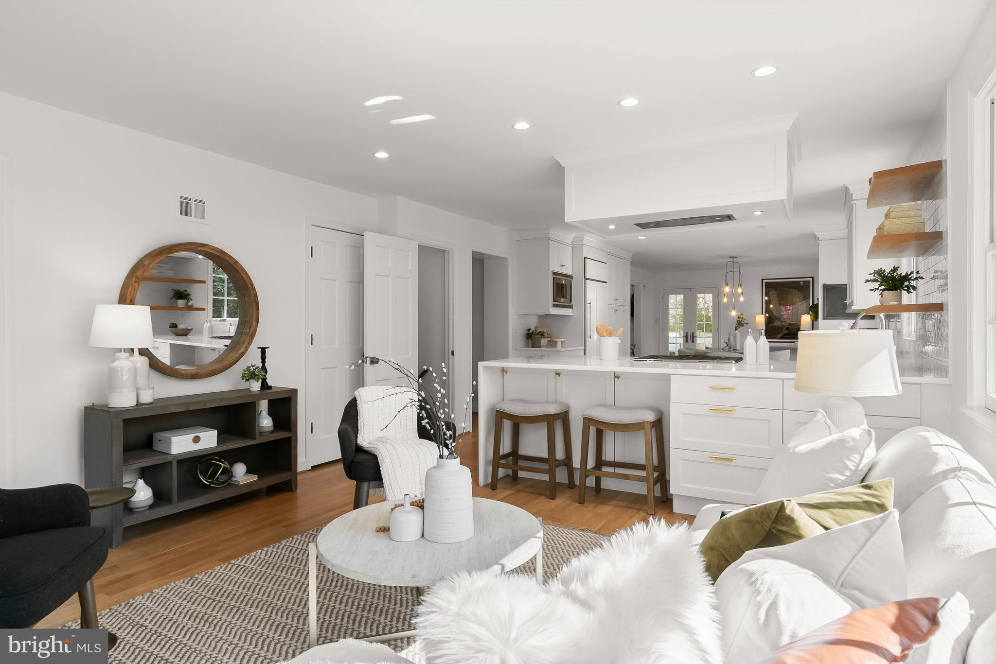 5120 Upton Street Northwest Washington, DC 20016 - Photo 15 of 53 a living room with furniture a rug kitchen view and a table