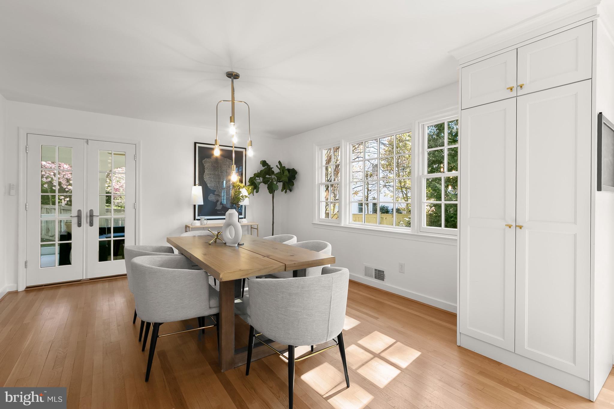 5120 Upton Street Northwest Washington, DC 20016 - Photo 18 of 53 a dining room with furniture window wooden floor