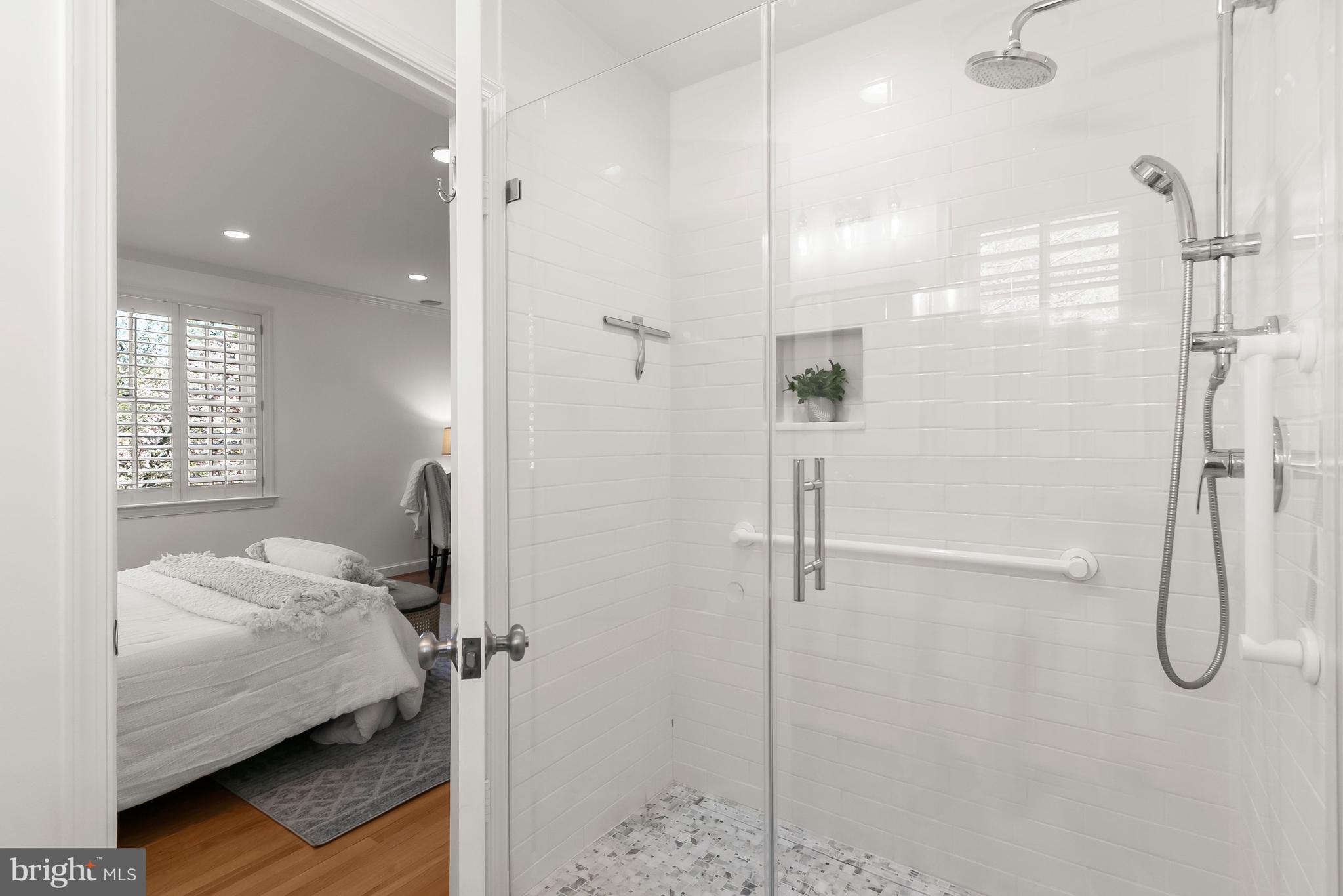 5120 Upton Street Northwest Washington, DC 20016 - Photo 25 of 53 a bathroom with a tub and shower