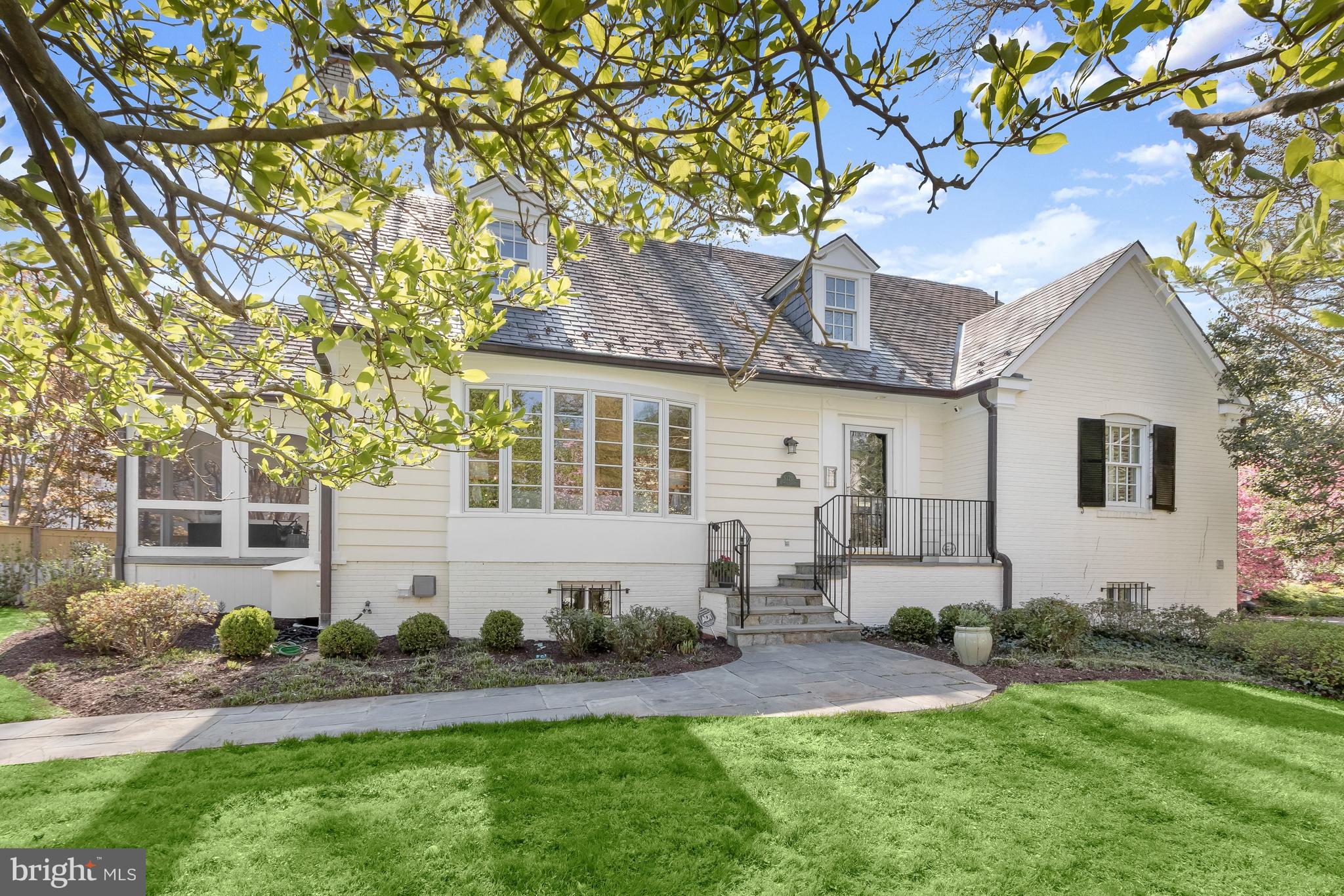 5120 Upton Street Northwest Washington, DC 20016 - Photo 3 of 53 a front view of a house with a yard and seating space