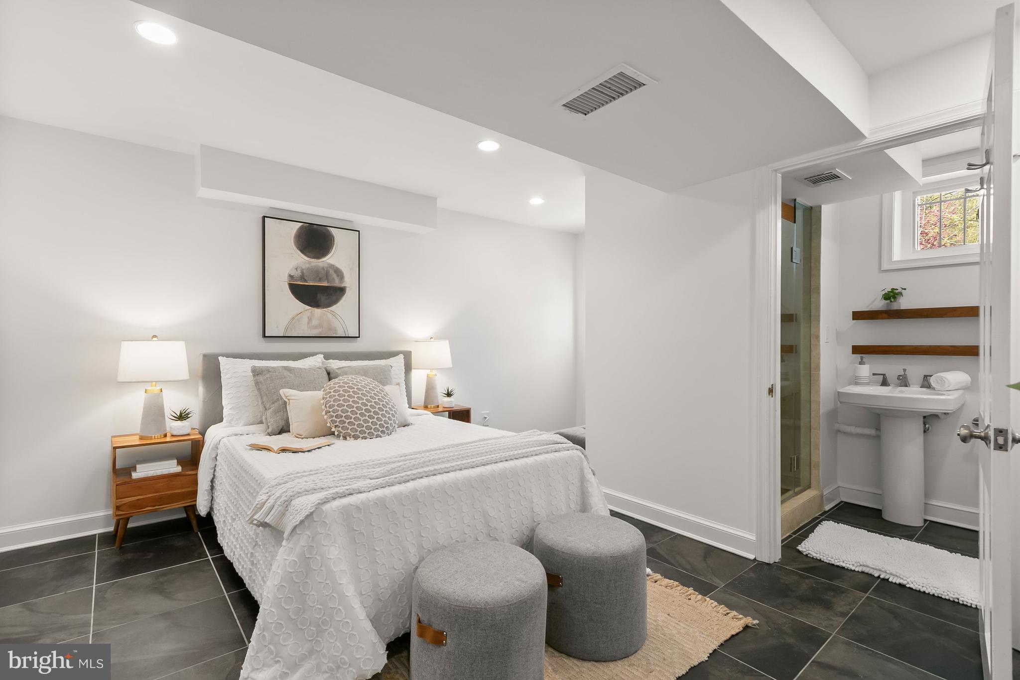 5120 Upton Street Northwest Washington, DC 20016 - Photo 36 of 53 a bedroom with a bed and a window