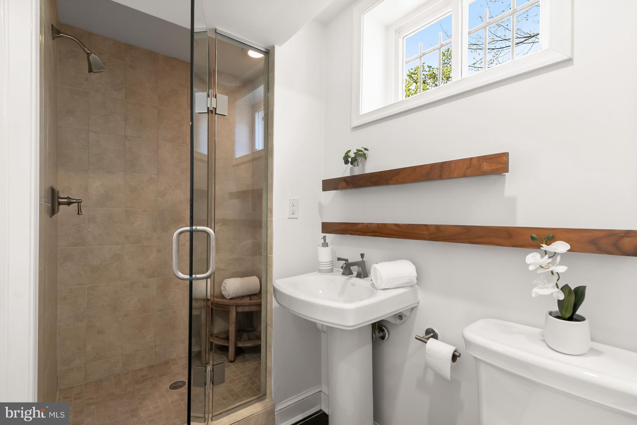 5120 Upton Street Northwest Washington, DC 20016 - Photo 37 of 53 a bathroom with a sink and mirror