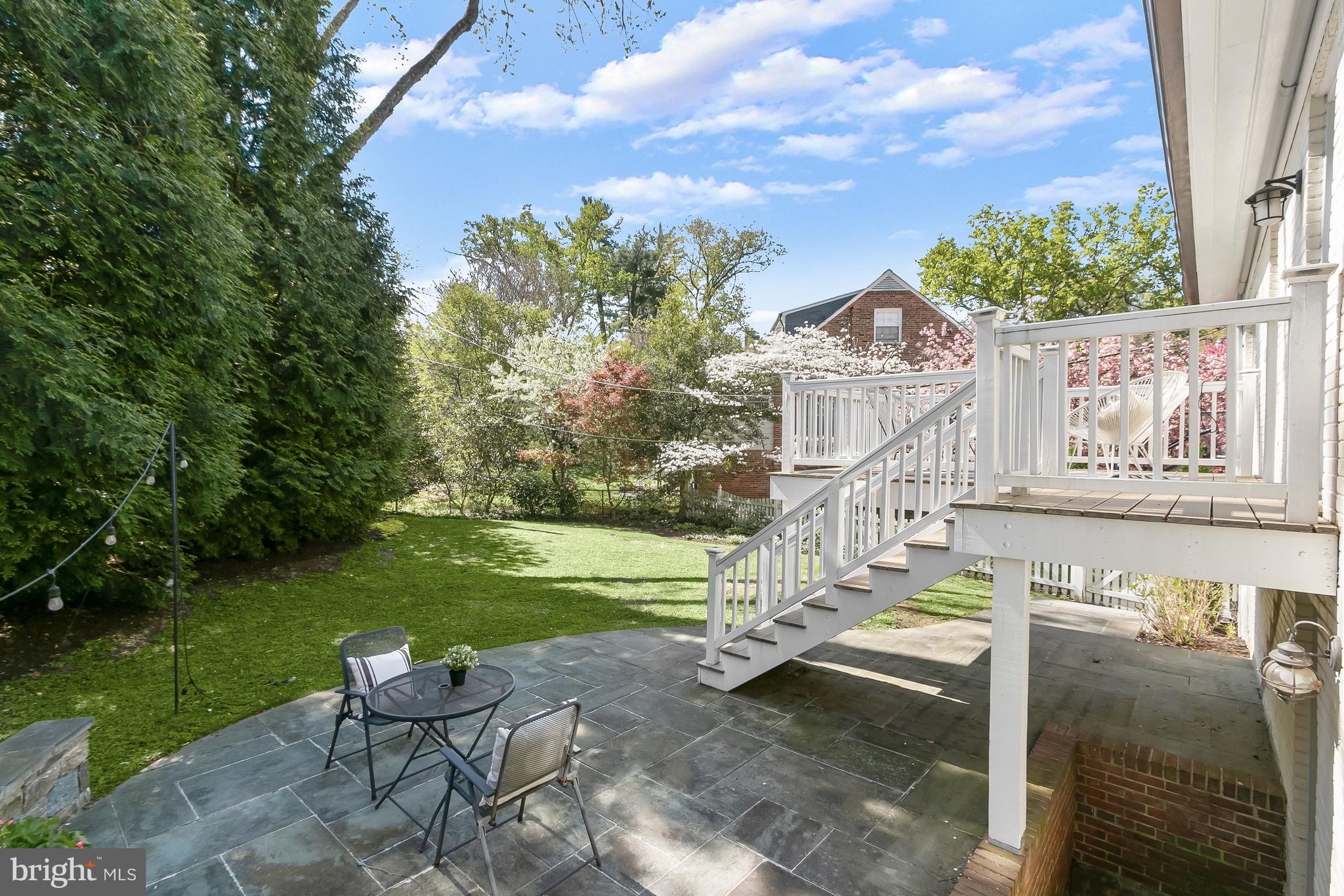 5120 Upton Street Northwest Washington, DC 20016 - Photo 45 of 53 a backyard of a house with table and chairs