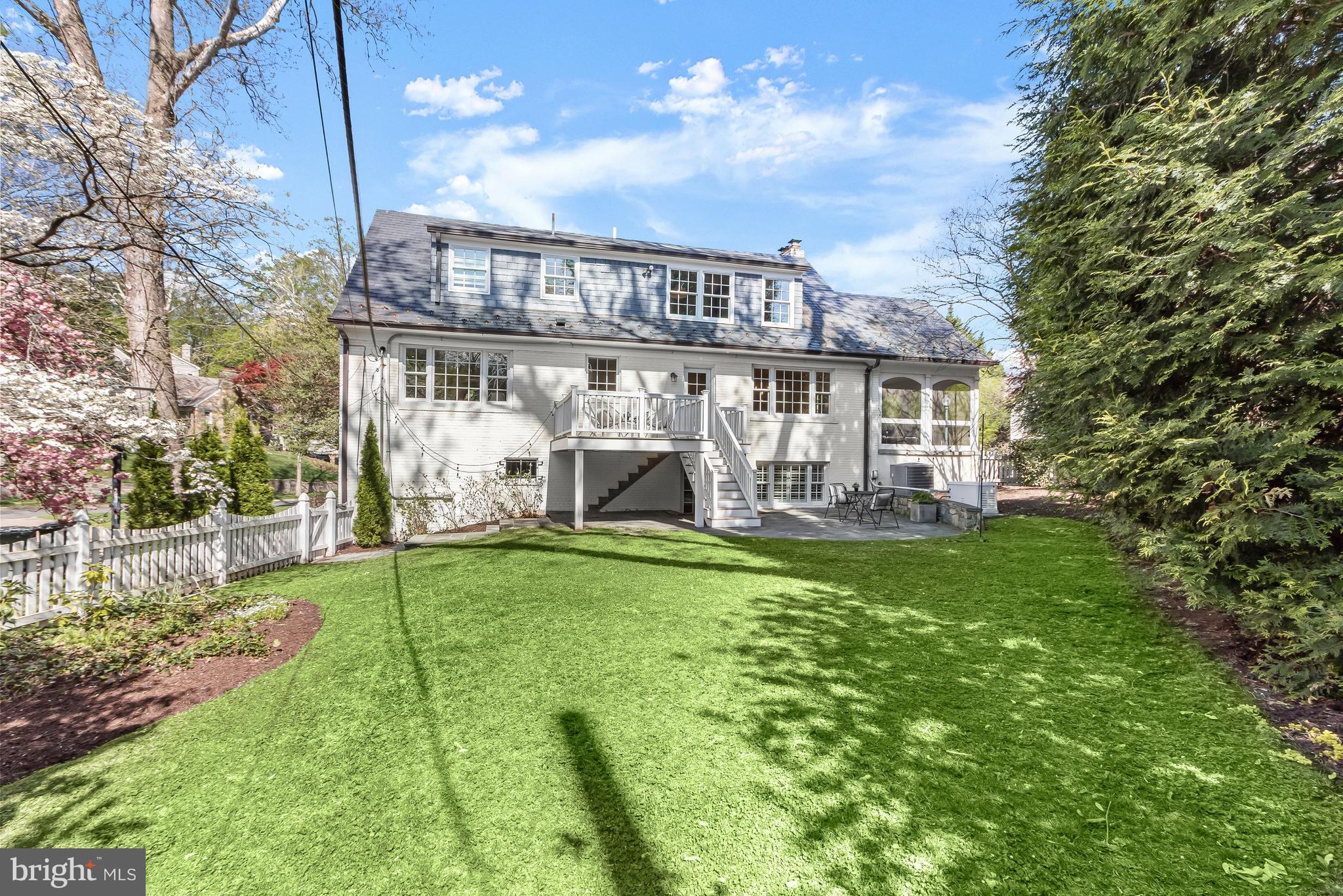 5120 Upton Street Northwest Washington, DC 20016 - Photo 46 of 53 a view of a house with backyard and porch