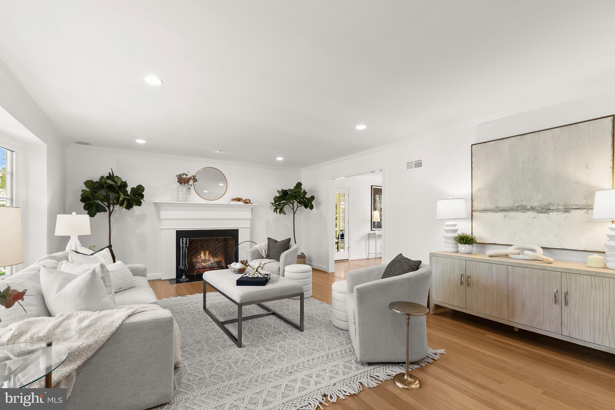 5120 Upton Street Northwest Washington, DC 20016 - Photo 6 of 53 a living room with furniture a fireplace and a table
