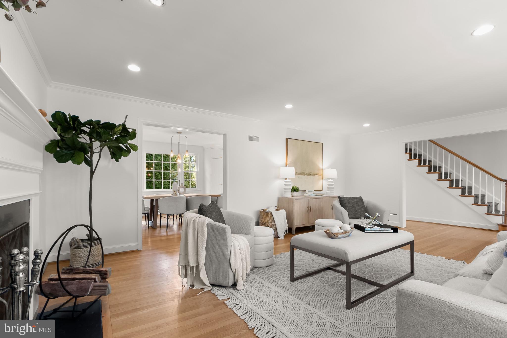 5120 Upton Street Northwest Washington, DC 20016 - Photo 7 of 53 a living room with furniture a chandelier and a potted plant