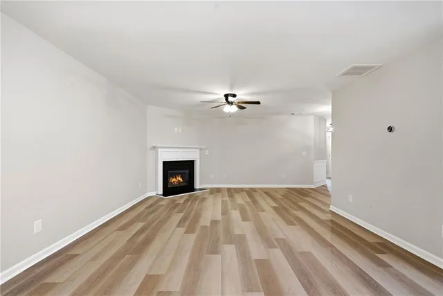 a view of a kitchen with a sink and a refrigerator