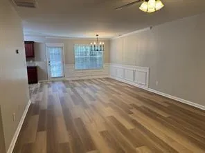 a kitchen with stainless steel appliances granite countertop a refrigerator stove top oven and sink