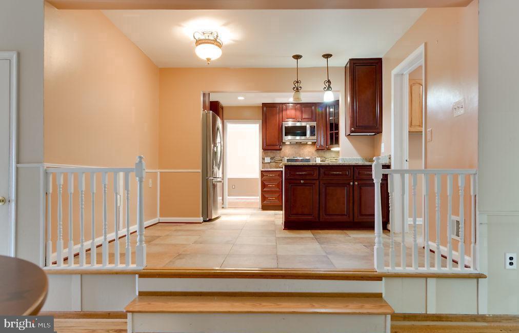 7801 Cliffside Court Springfield, VA 22153 - Photo 14 of 71 a view of kitchen with cabinets and outdoor space