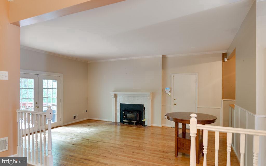 7801 Cliffside Court Springfield, VA 22153 - Photo 26 of 71 a view of a livingroom with wooden floor and a fireplace