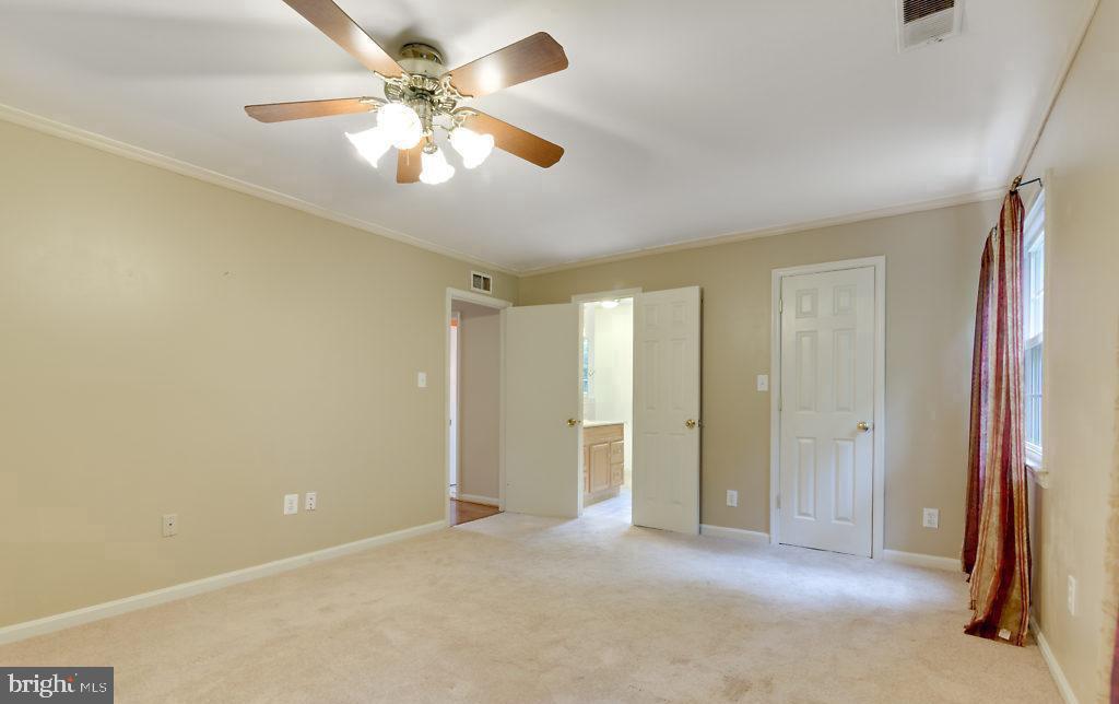 7801 Cliffside Court Springfield, VA 22153 - Photo 37 of 71 a view of an empty room with a chandelier fan