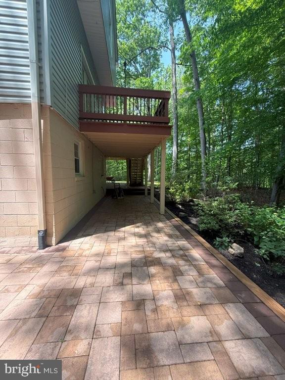 7801 Cliffside Court Springfield, VA 22153 - Photo 70 of 71 a view of a patio with table and chairs with wooden floor