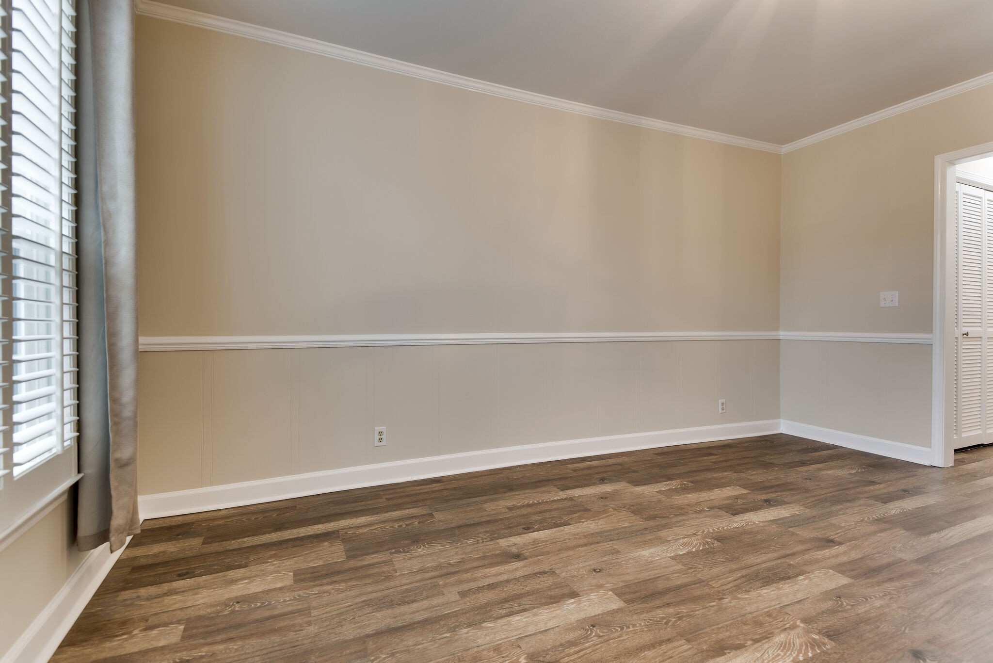 737 General George Patton Road Nashville, TN 37221 - Photo 14 of 36 a view of an empty room with wooden floor and a window