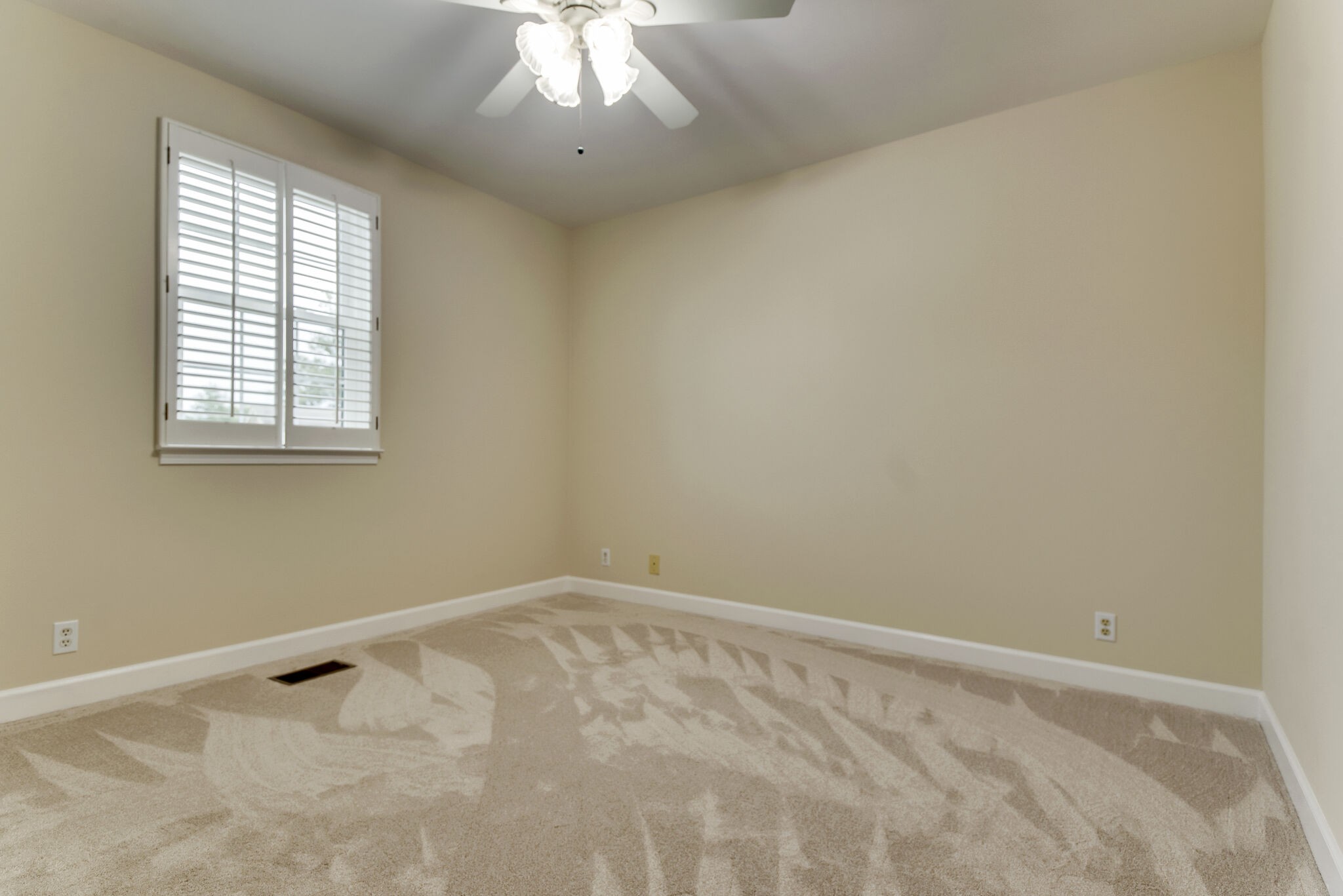 737 General George Patton Road Nashville, TN 37221 - Photo 10 of 36 an empty room with a chandelier fan and windows