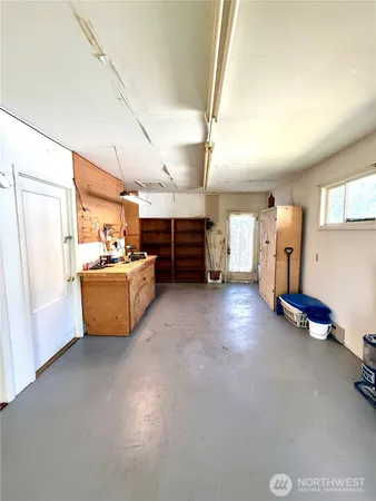 a kitchen with a stove a sink and a microwave
