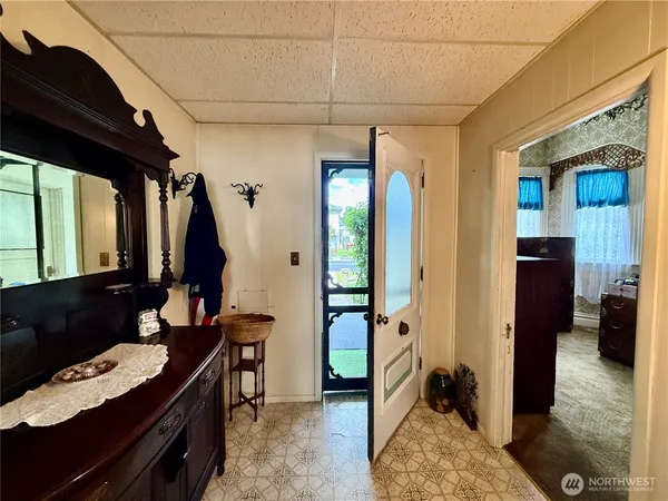 a spacious bedroom with a bed and a window