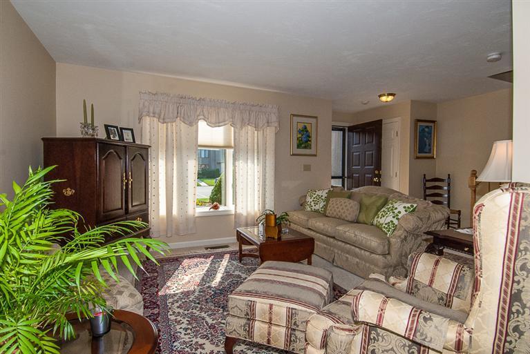 481 Buck Island Road, Unit 15D West Yarmouth, MA 02673 - Photo 11 of 21 a living room with furniture a large window with potted plants