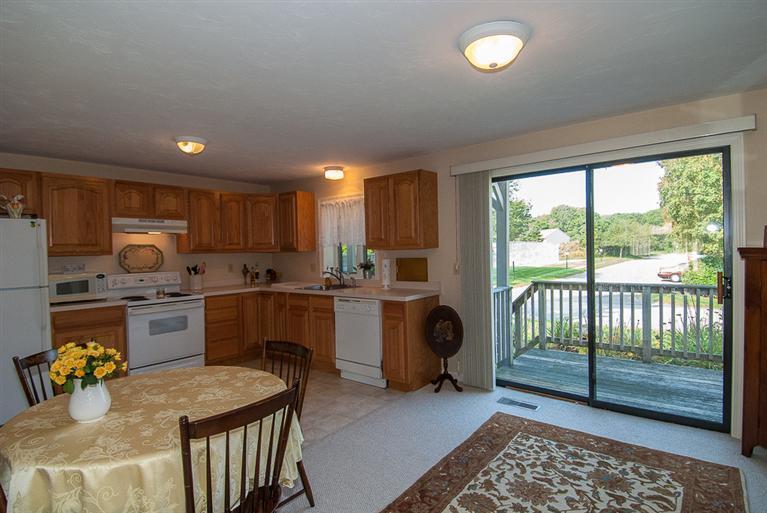 481 Buck Island Road, Unit 15D West Yarmouth, MA 02673 - Photo 13 of 21 a kitchen with sink refrigerator and stove